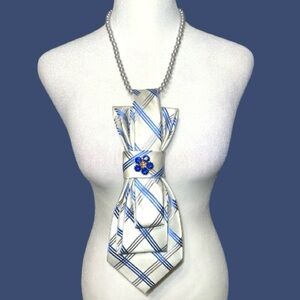Elegant Blue and Silver necktie Necklace with blue accent flower.
